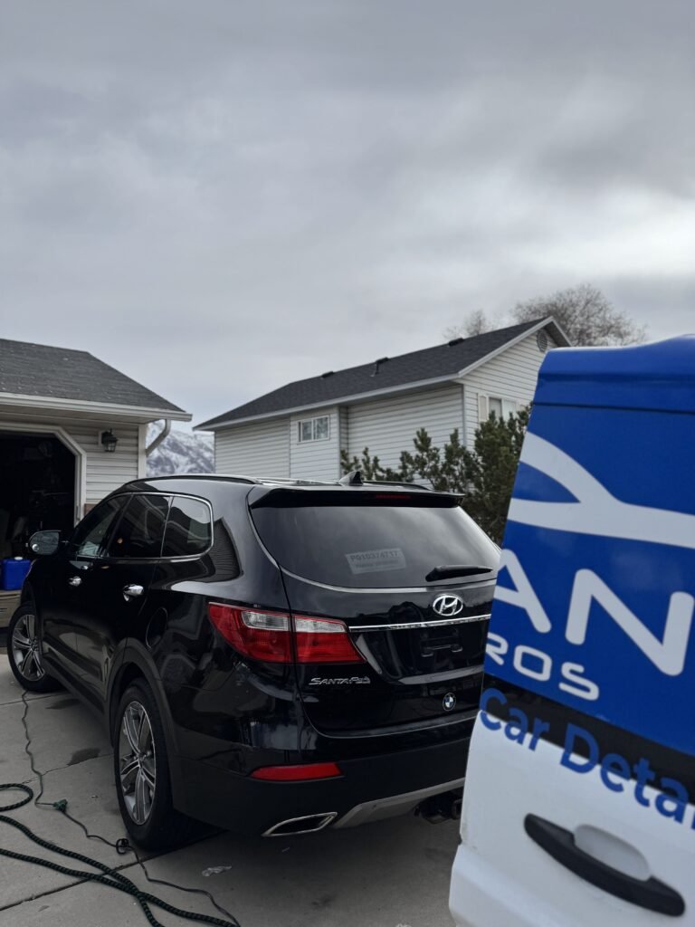 Cleaner Bros detailing a car in Utah County
