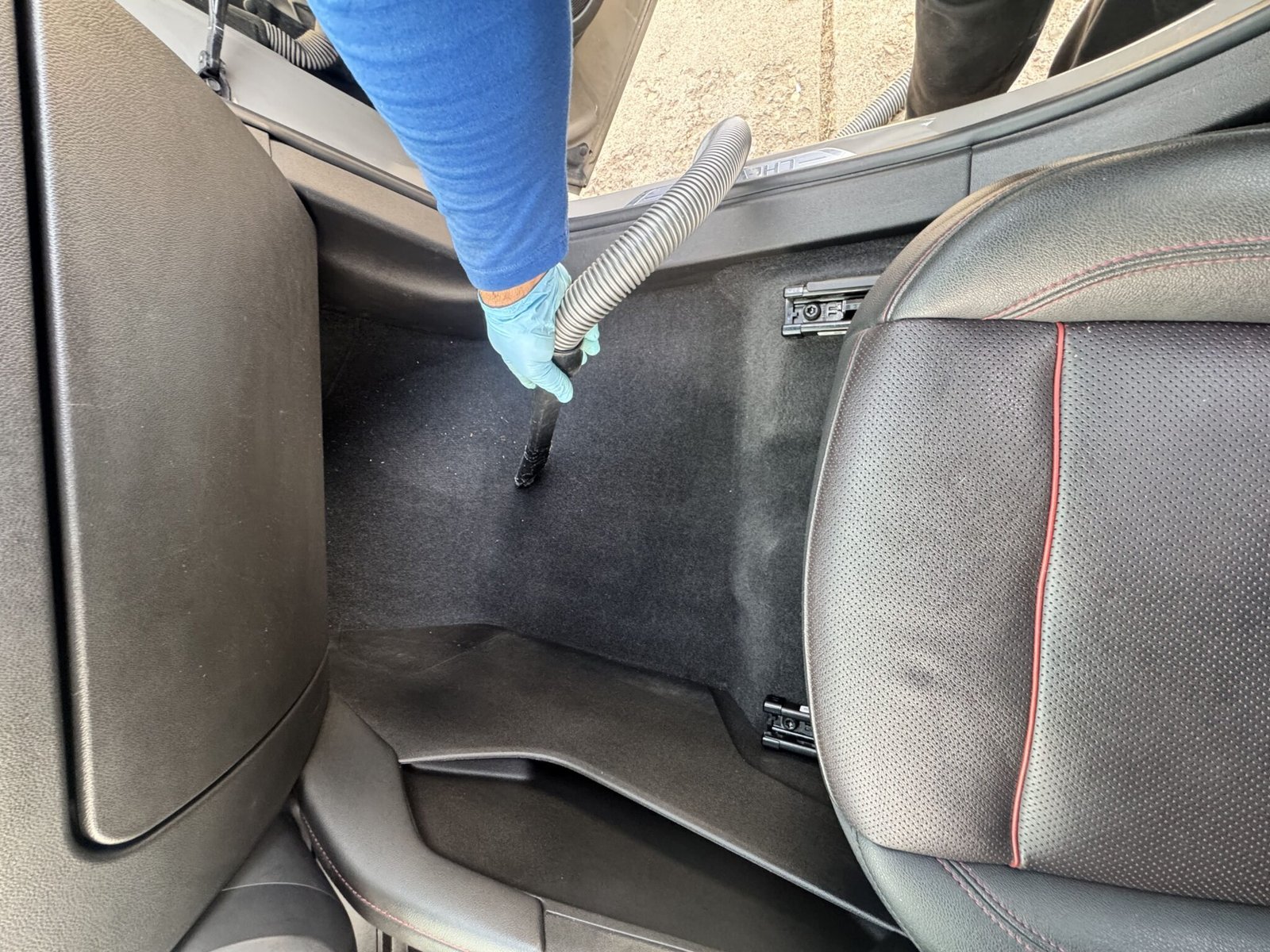 Professional vacuuming car interior