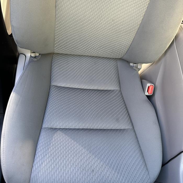 Gray cloth driver seat clean after shampoo