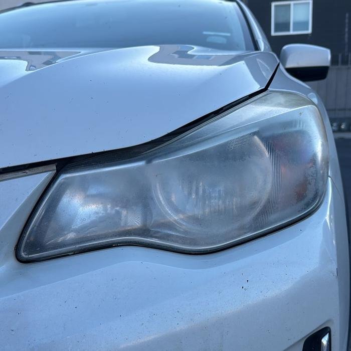 Subaru headlight foggy before restoration