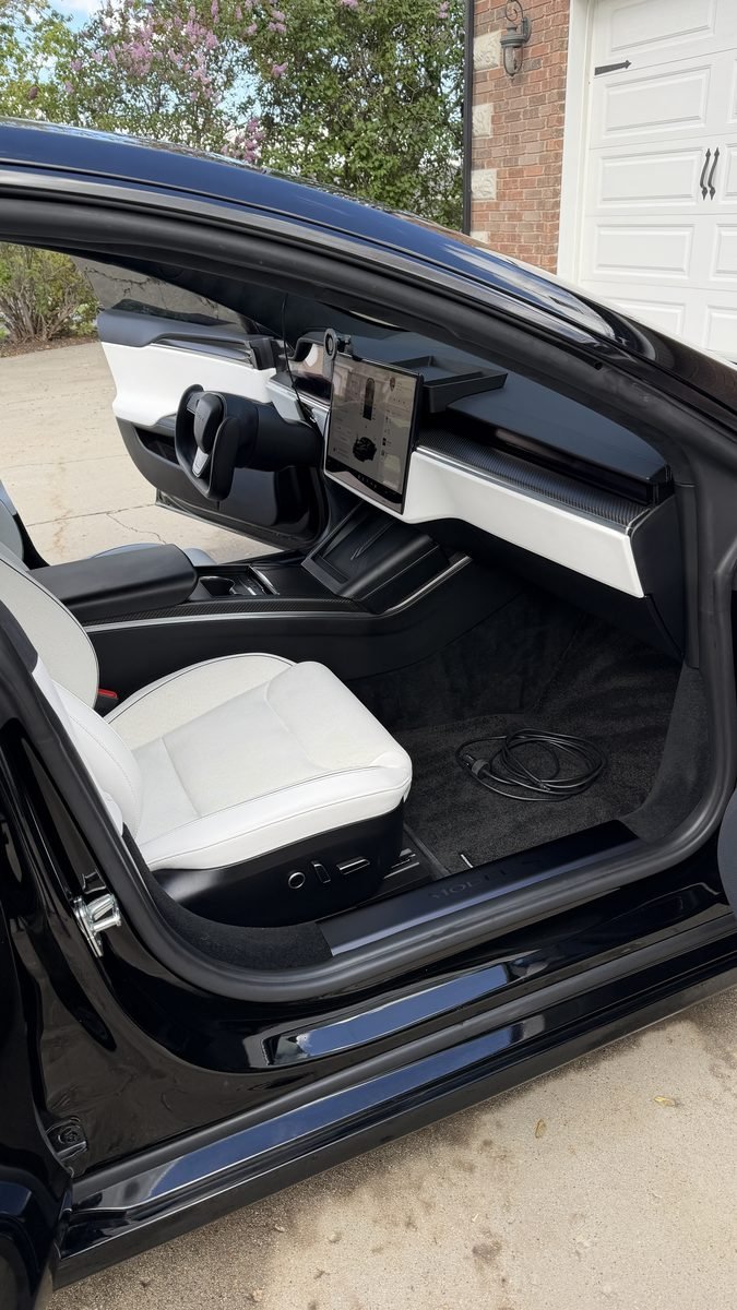 White Tesla front seat after an interior detail in Spring Lake