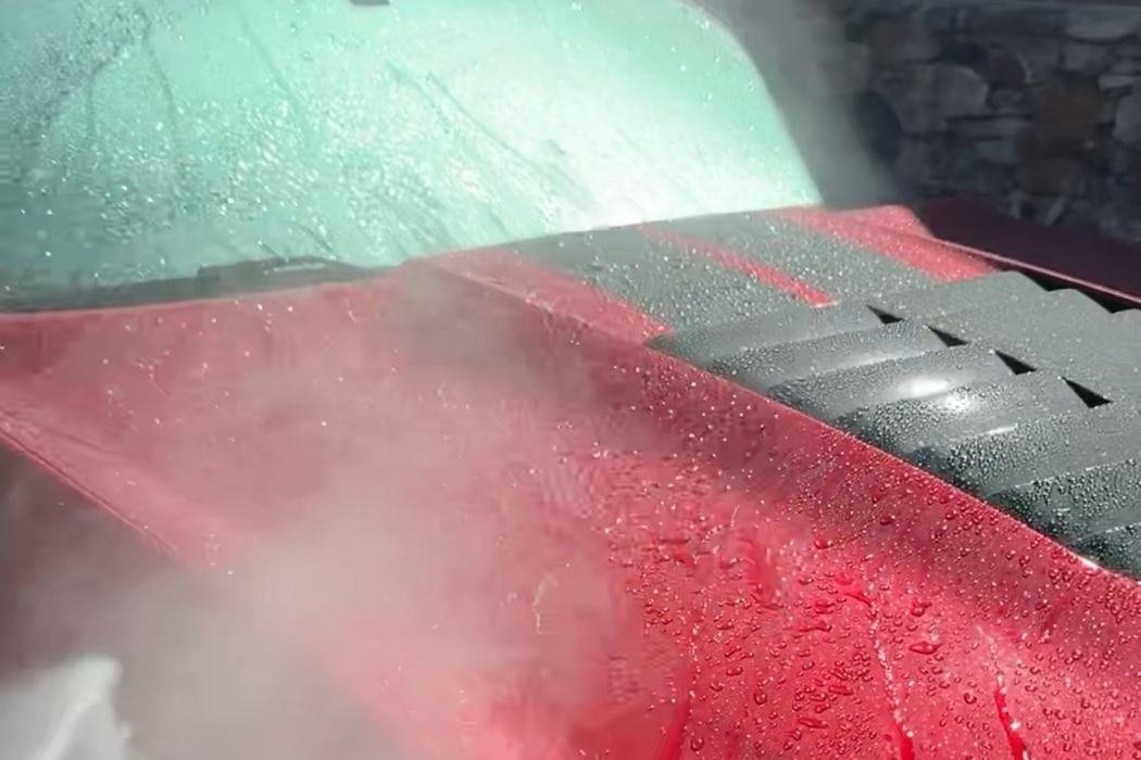 Rinsing a Mustang during an exterior detail in Highland