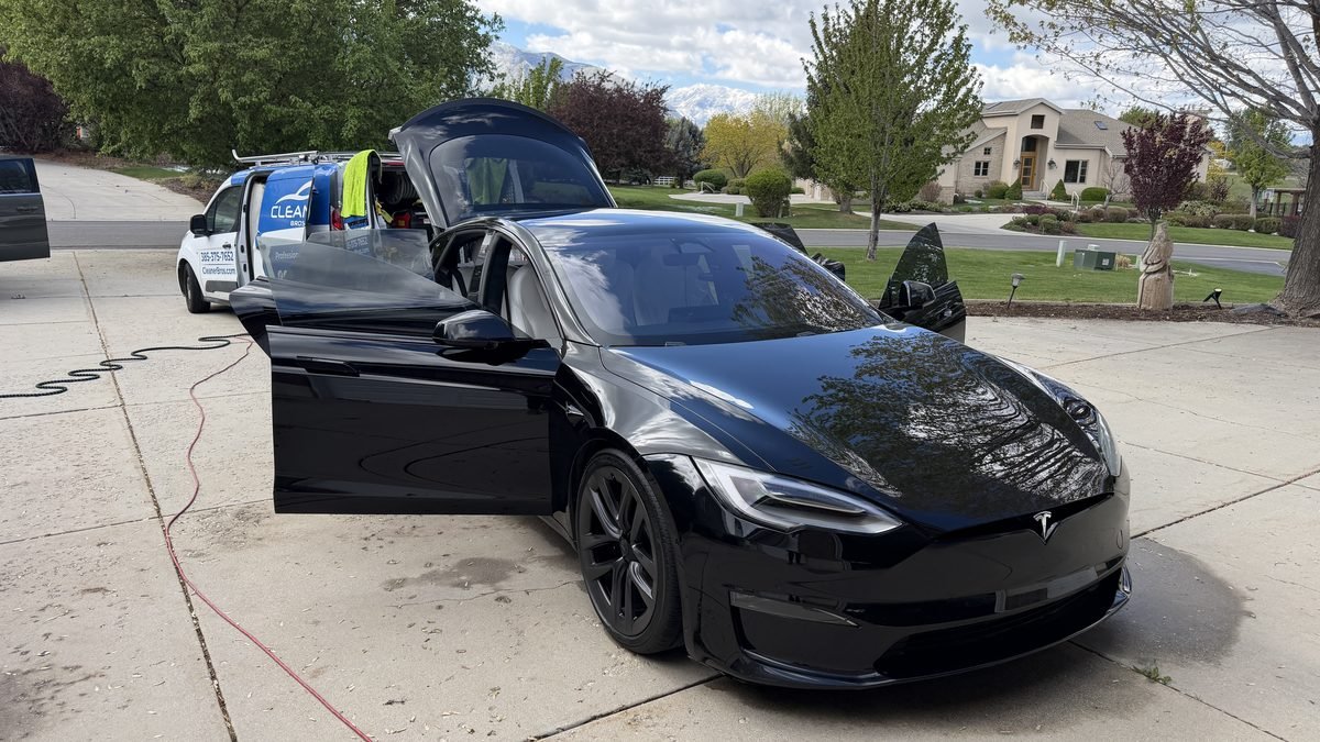 Cleaner Bros van and a Tesla Model S during a mobile detail in Cedar Hills, Utah