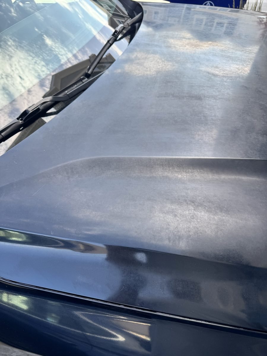 Oxidized, dull dark hood before polishing