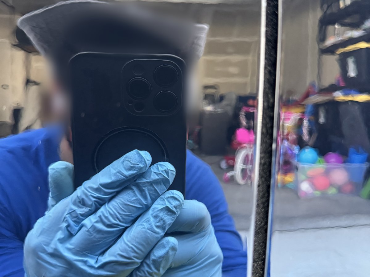 Black car door after scratch removal by machine polishing